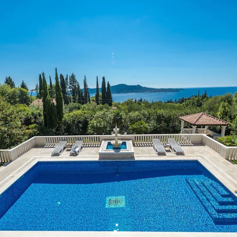 Plunge into your luxurious private pool overlooking the sea