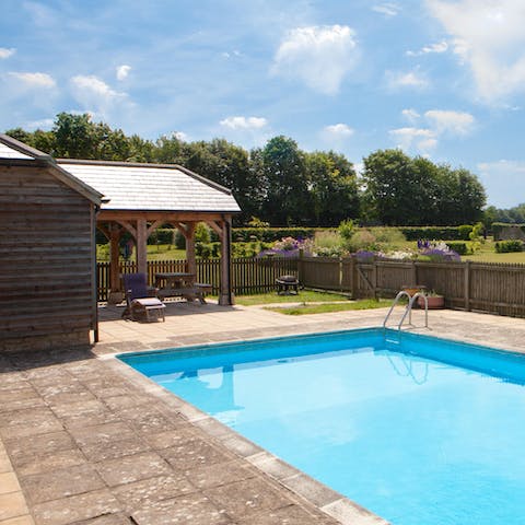 Spend sunny afternoons in the outdoor swimming pool