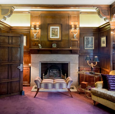 Cosy up in front of the grand fire place