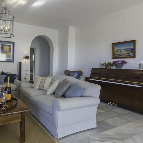 Be the star of the show on the piano in one of the comfortable living rooms