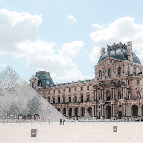 Take a twelve-minute stroll through the streets of Paris to visit the iconic Louvre Museum 