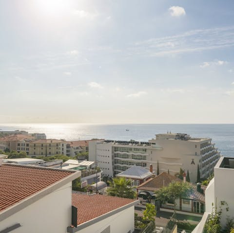 Enjoy a stroll along the seafront promenade before heading to Funchal city centre, a ten-minute drive away