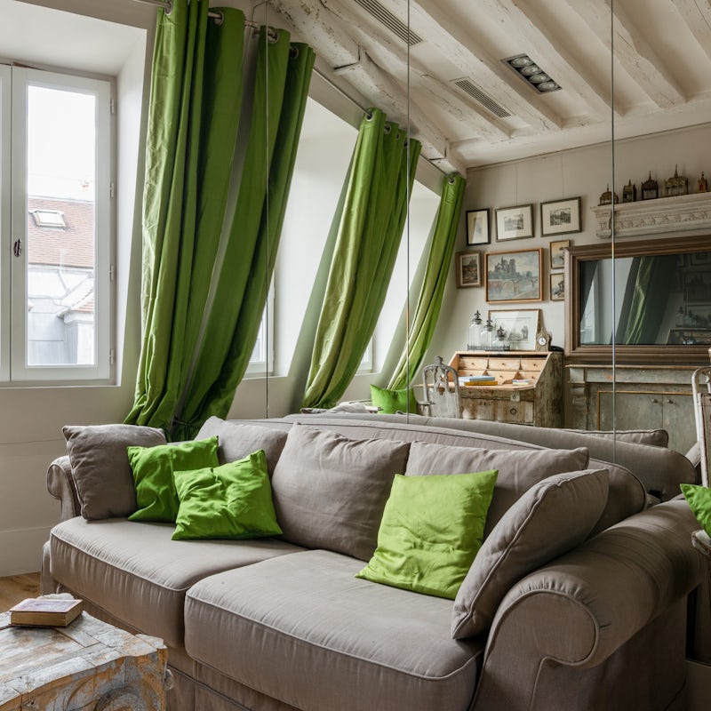 Relax in an elegant Parisian space filled with antiques