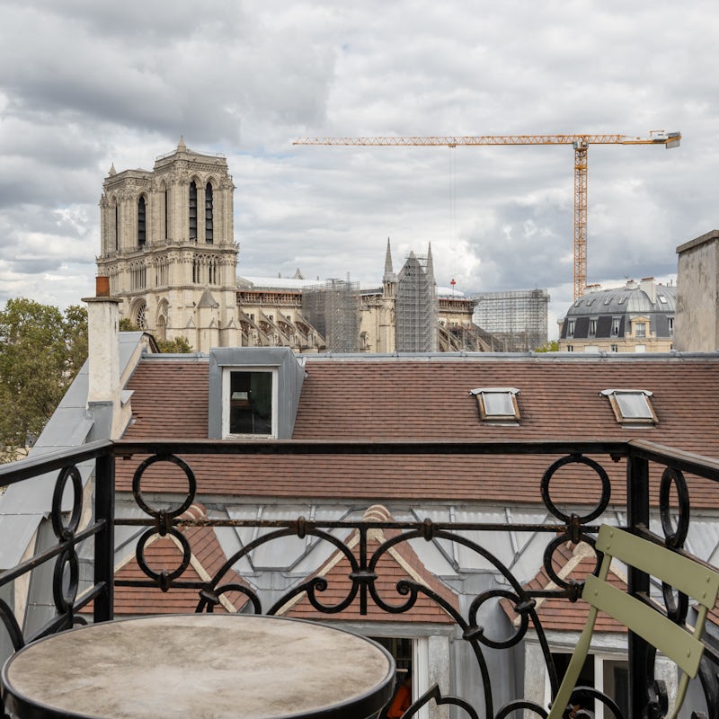 Wake up to views of Notre Dame, coffee in hand on your own private balcony