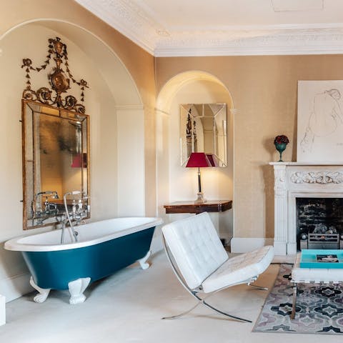 Amp up the romance by relaxing in a roll-top bathtub in the main bedroom