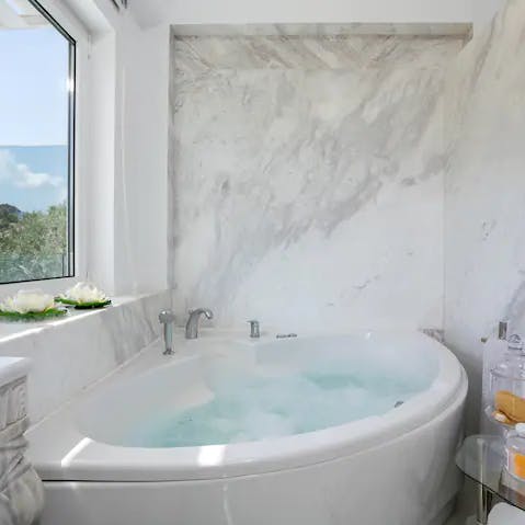 Unwind in the soothing bubbles of the hot tub bath