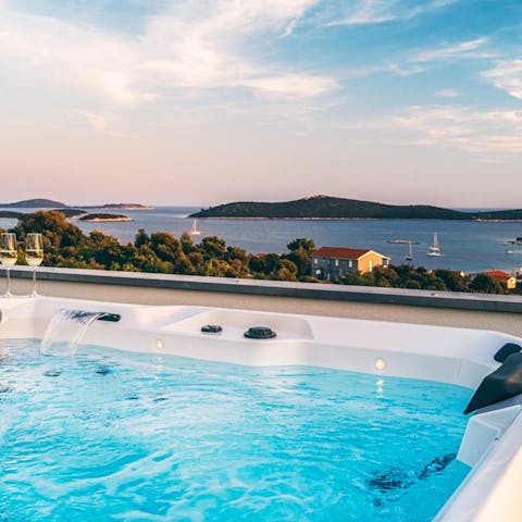 Admire the islands on the horizon from the bubbling hot tub