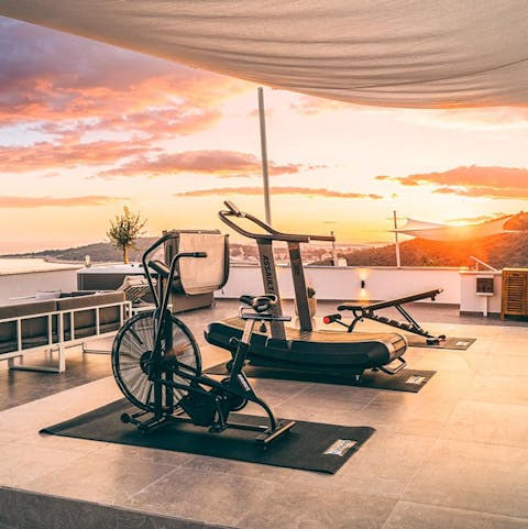 Enjoy a sunset workout in the rooftop gym