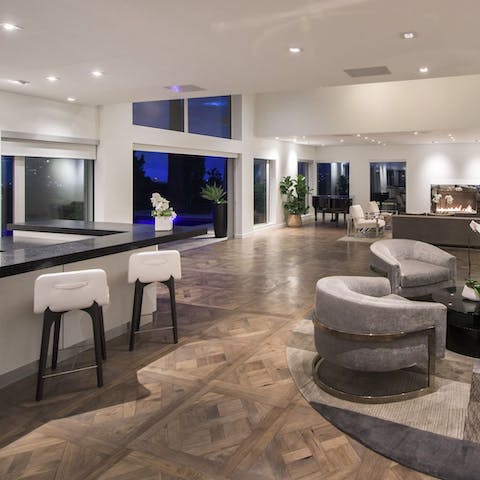 Entertain guests in the home's huge open-plan living space, complete with its own bar