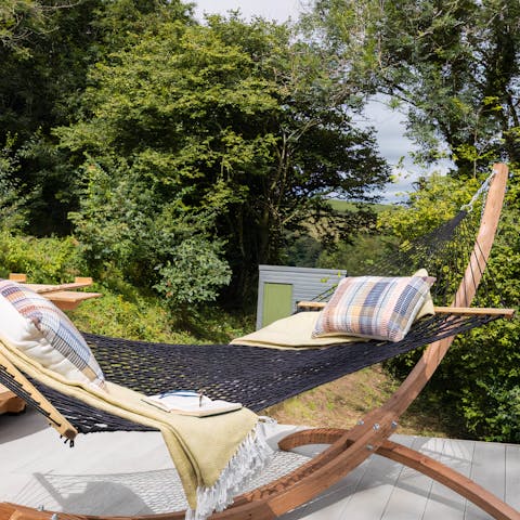 Laze away and watch the birds pass overhead from the comfort of your hammock