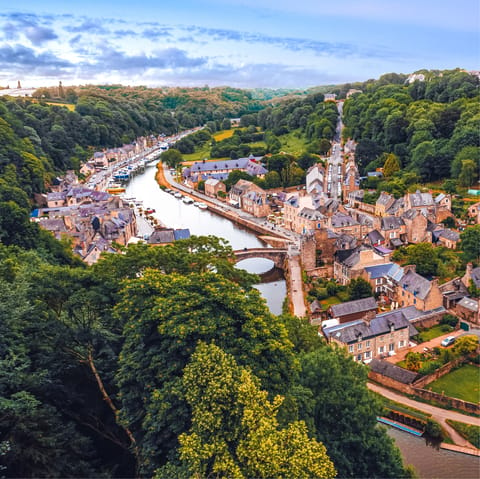 Explore the medieval ramparts and cobblestone streets of Dinan, just 2km away