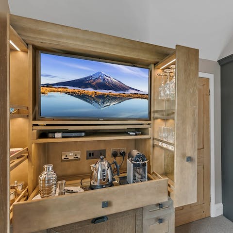 Indulge in a late-night apéritif from the built-in drinks fridge in the master bedroom