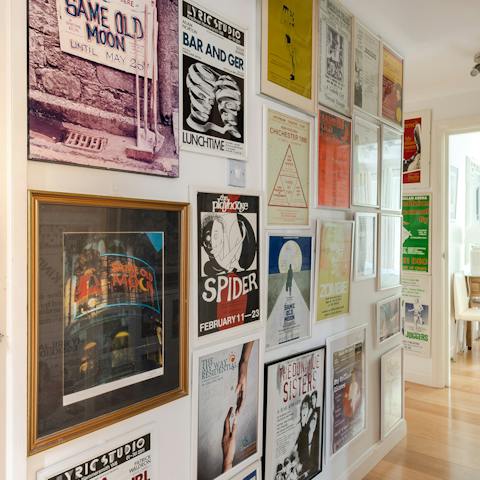 Admire the gallery wall filled with prints and posters