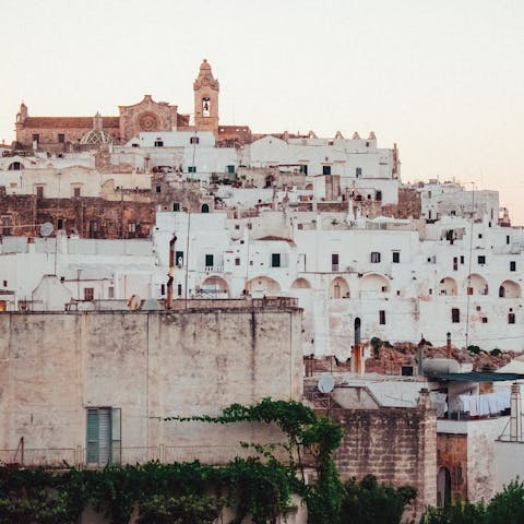 Explore the iconic 'white city' of Ostuni – a thirty-minute drive away