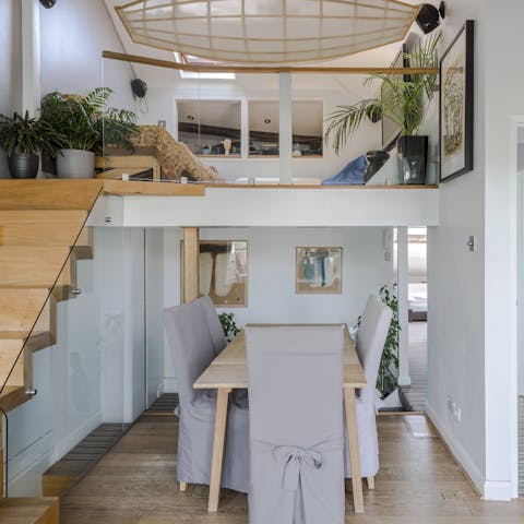 Savour a home cooked meal at the dining table or relax on the mezzanine with its suspended boat