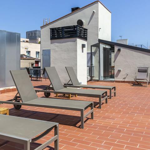 Take a cold glass of wine up to the communal roof terrace in the evening