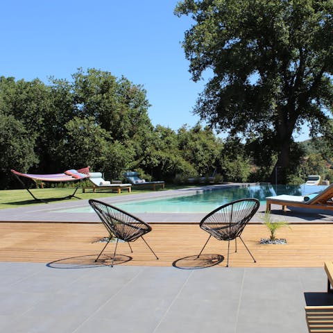 Relax in the hammock by the large private swimming pool