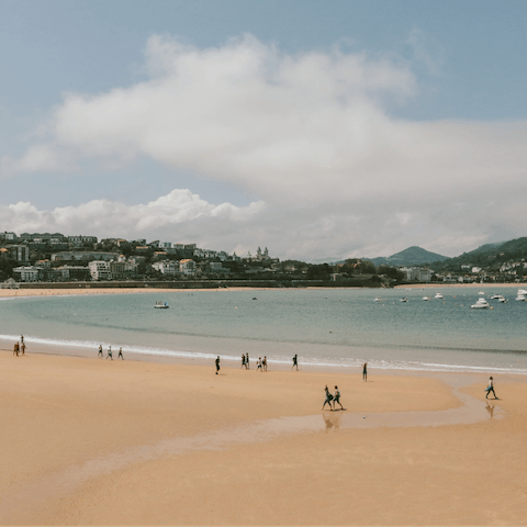 Sink your toes into the golden sand of  La Concha Beach, a short walk away