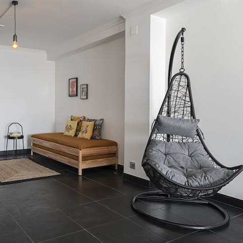 Cosy up with a book in the living room's hanging chair