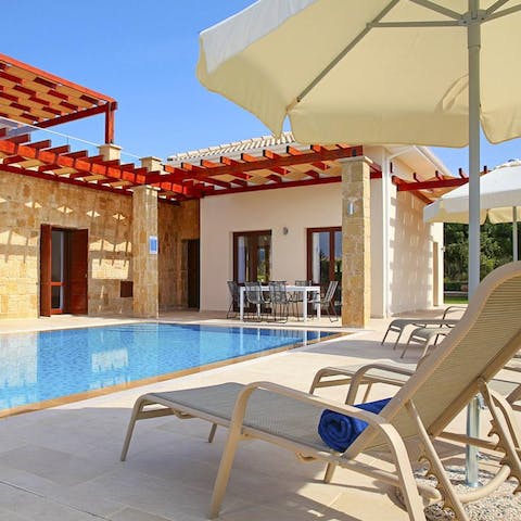 Lie back on the sun loungers by the private pool after a morning swim