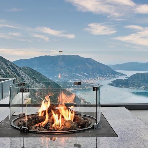 Light up the fire pit once the sun's gone down and gather the group together on the terrace
