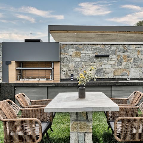 Work culinary magic in the outdoor kitchen and dine alfresco