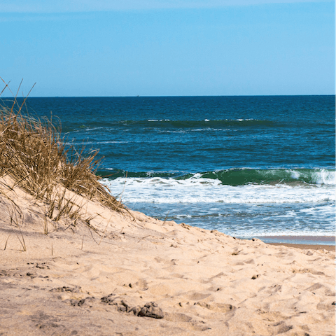 Relax on the soft sands of Rogers Beach, a four-minute drive away