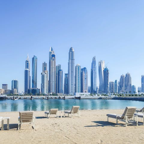 Gaze out at the city skyline from your building's private beach