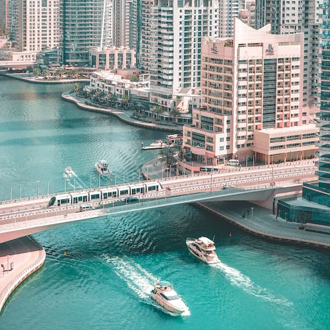 Take a stroll along Dubai Marina Walk, a short taxi ride from home