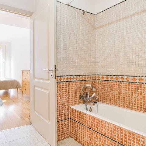 Treat yourself to a restorative soak in the mosaic-tiled bathtub