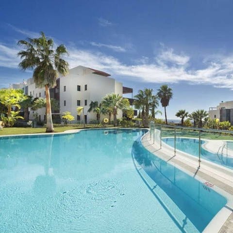 Swim in one of five communal pools to cool off in the Spanish sun