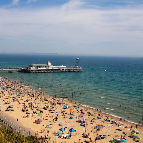 Sunbathe on the vibrant Bournemouth Beach, just a twenty-minute walk away