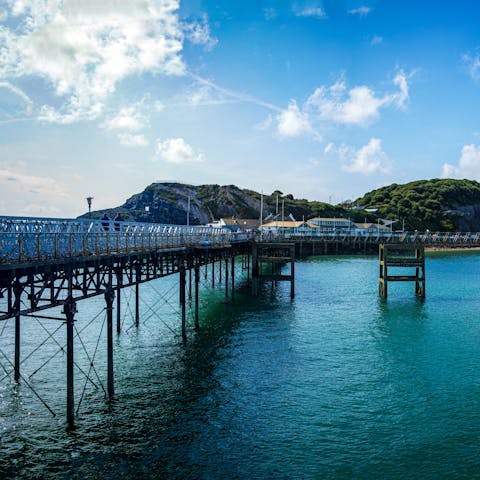 Grab fish and chips from Mumbles Pier, just a fifteen-minute stroll away