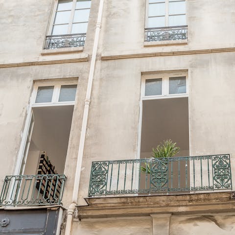 Open the French doors on sunny days and watch the street-life below