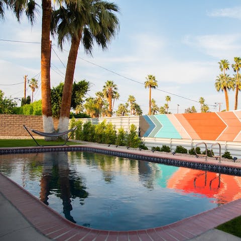 Take a dip in the heated pool with views of the mountains