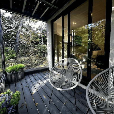 Embrace the outdoors no matter the weather in the enclosed glass balcony