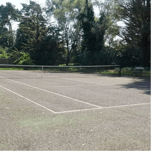 Show off your serving prowess on the private tennis court