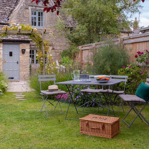 Set up for tea or a meal in the flower-filled garden