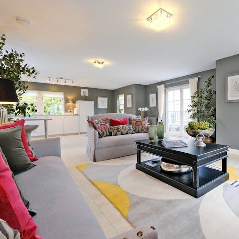 Relax in the open-plan living space with a cup of tea and a plate of shortbread after a busy day