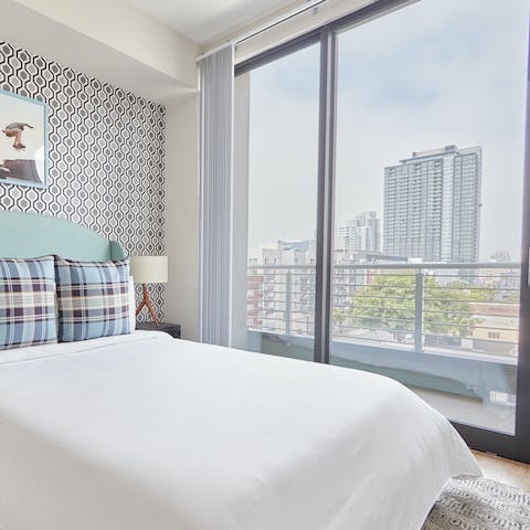 Wake up to city skyline views in the master bedroom