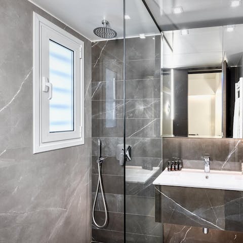 Pamper yourself in the modern bathroom with its rainfall shower