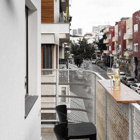 Sip wine on your private balcony overlooking Nahalat Binyamin Street, just steps from the famous street market