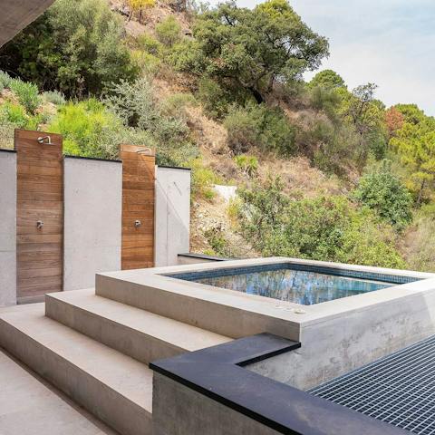 Luxuriate in the stone Jacuzzi, surrounded by nature