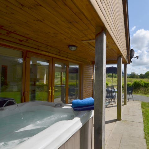 Relax in the hot tub, surrounded by nature