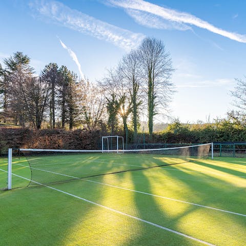 Get competitive at the club house's tennis courts 