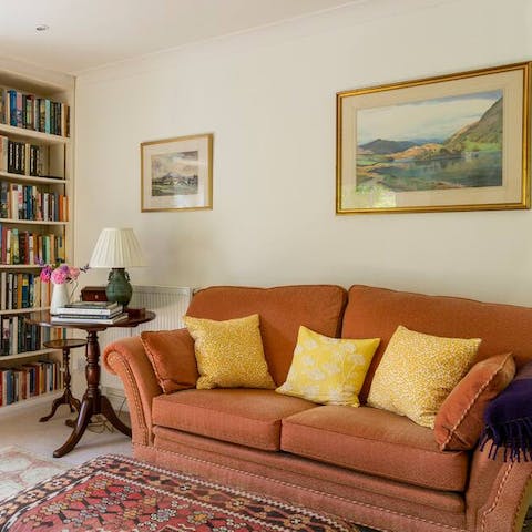 Relax in the bright living space with a book plucked from the shelves