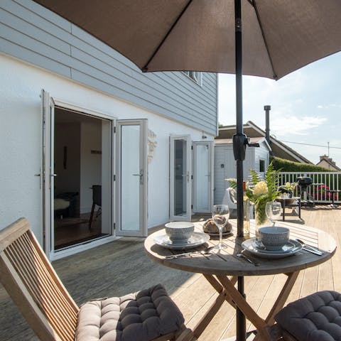 Savour a fresh cup of tea on the sun-soaked terrace