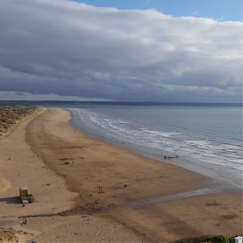 Go for a relaxing stroll along Saunton Sands, a ten-minute drive from home
