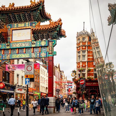 Discover the excitement of Soho's Chinatown, a fifteen-minute walk away