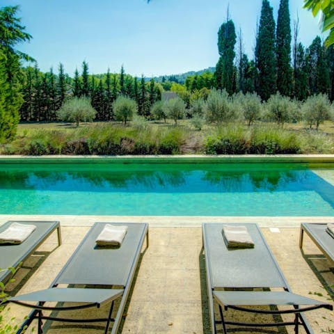 Admire the tree-lined view while splashing in the private pool